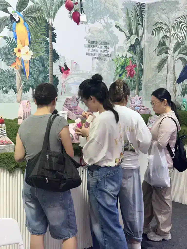 Visitors reviewing cosmetic products at the 2026 Guangzhou beauty expo