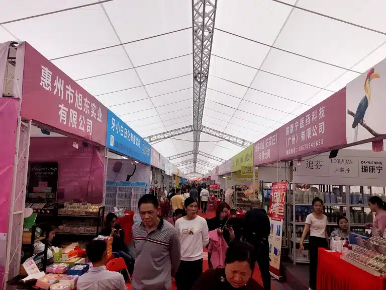 Busy product aisles and buyers at a previous YIFA beauty expo