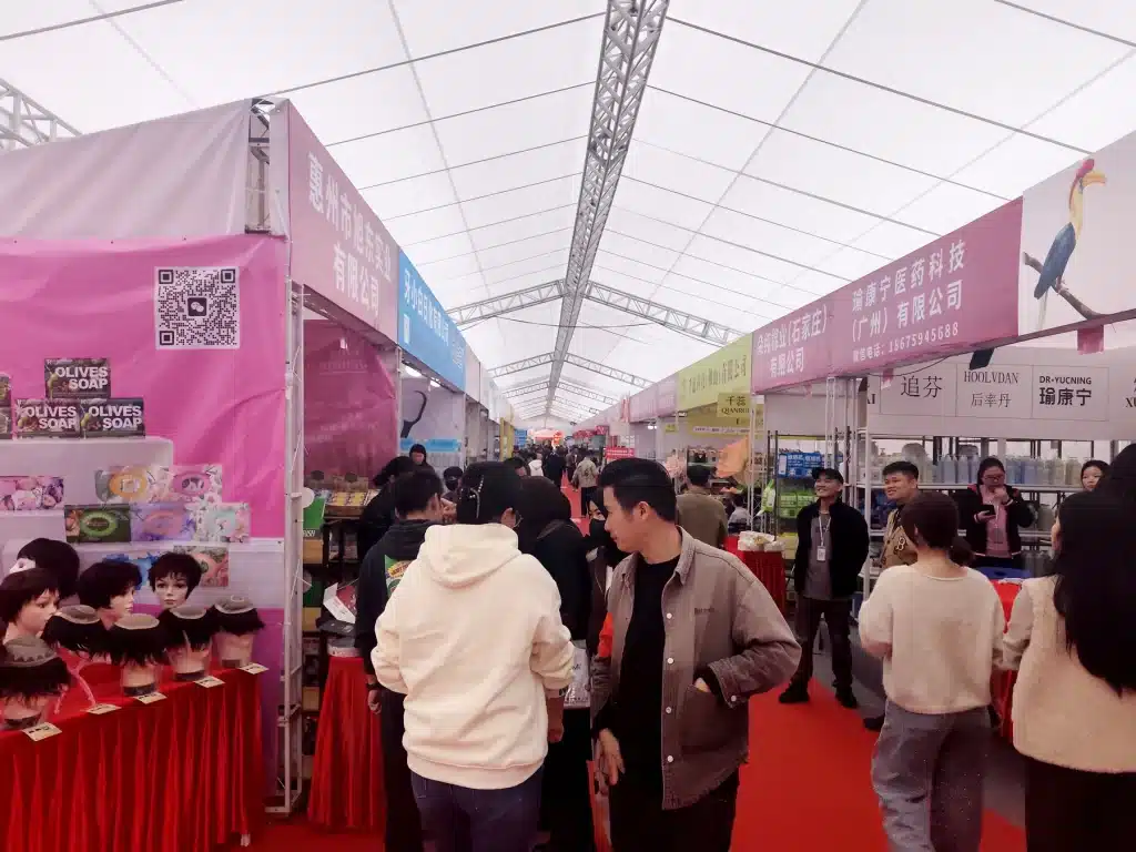 Buyers comparing products along exhibition aisles at a previous YIFA beauty expo