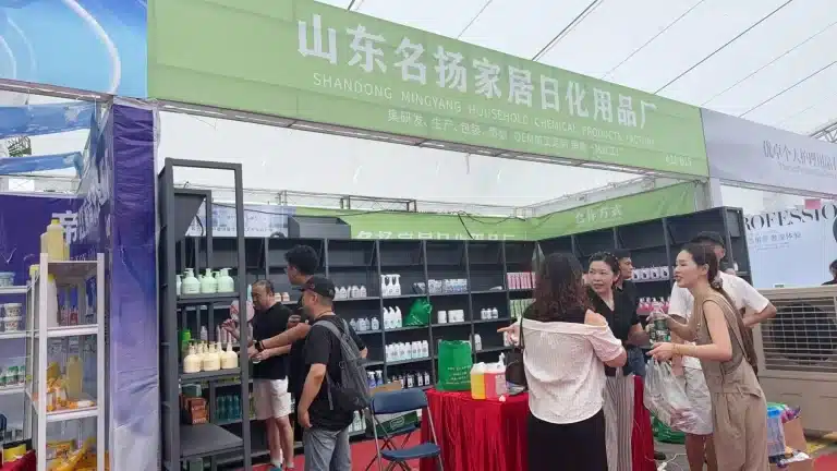 Buyers discussing personal care products at a YIFA beauty expo booth
