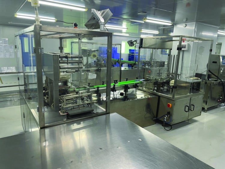 Enclosed production equipment shown in Kelly Cosmetics materials